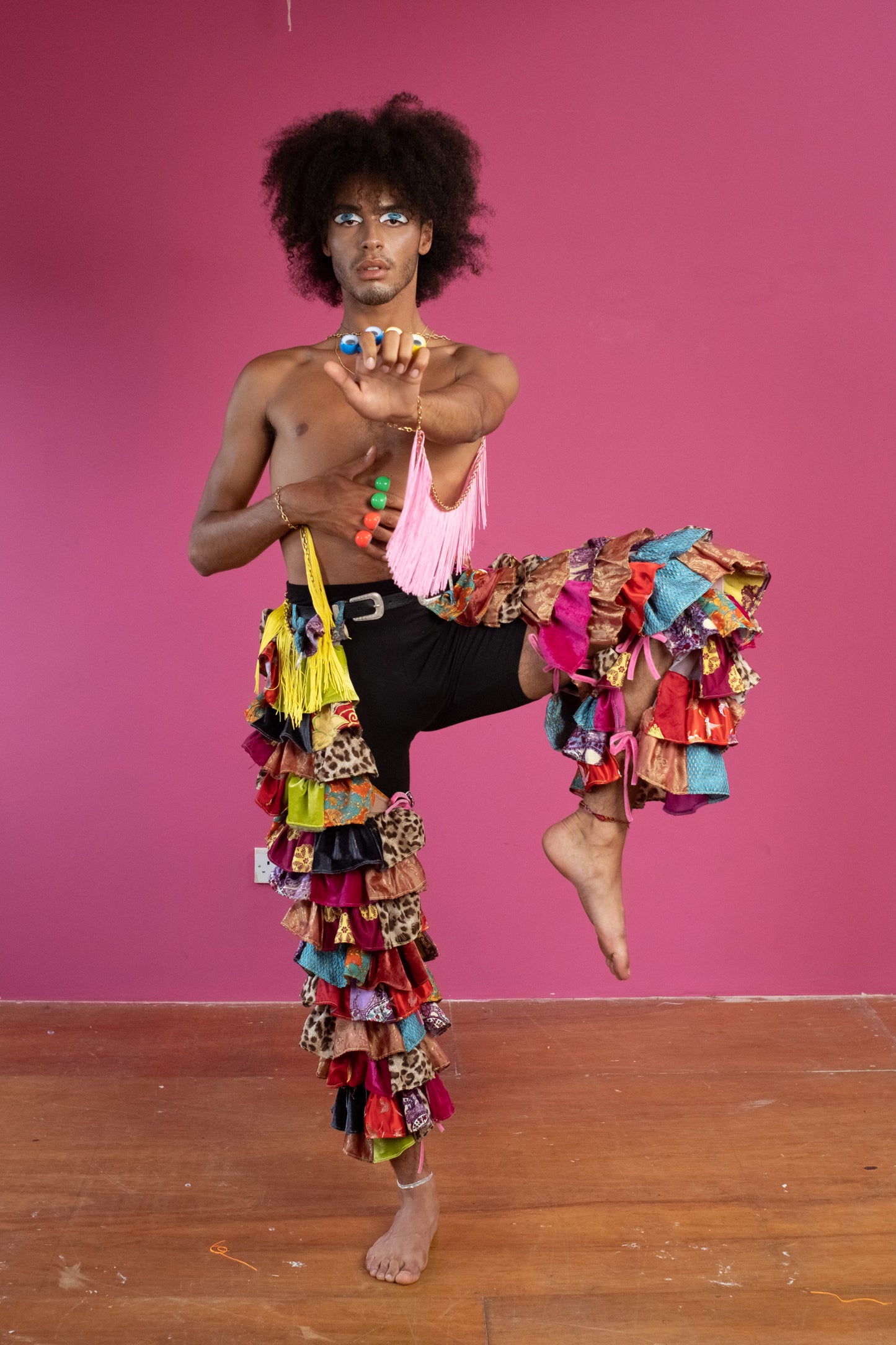 Patchwork Ruffle Chaps Male Model Doing Ninja Pose