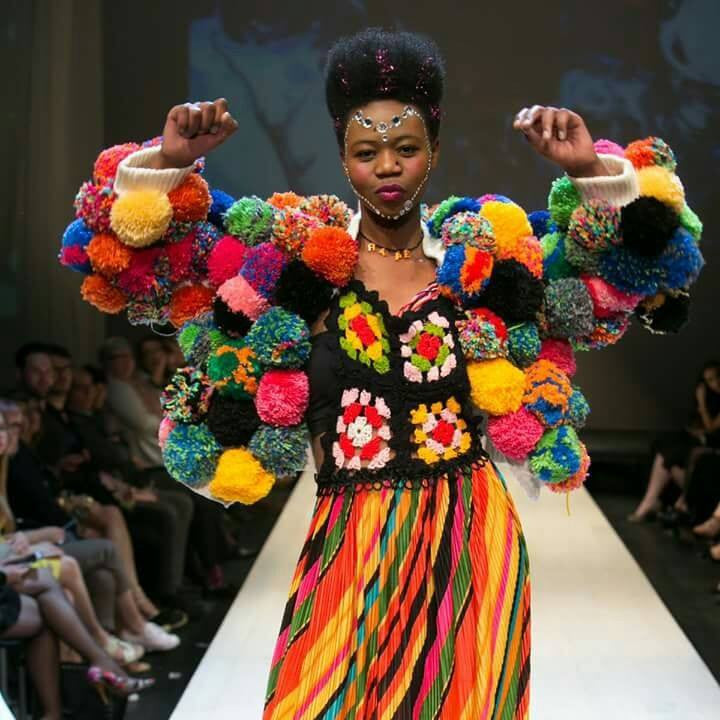 Pom Pom Jacket trippy hippy upcycle rainbow jacket on runway