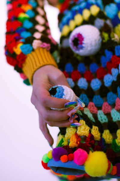 Free the Mind rainbow crochet trippy eye skirt pom pom detail